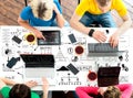 Students sitting at the table using computers and tablets Royalty Free Stock Photo