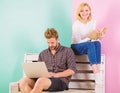 Students spend leisure preparing for entrance exam. Couple students with book and laptop studying. Man and woman use Royalty Free Stock Photo