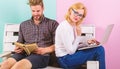 Students spend leisure studying. Couple students with book and laptop studying. Man and woman use different learning Royalty Free Stock Photo