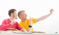 Students take a selfie picture in a classroom