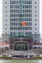 Students taking graduate pictures in front of campus building in Xiamen University, China