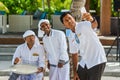 Students taking selfie with muslim maldivian orthography teacher