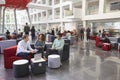 Students talking in busy university campus building Royalty Free Stock Photo