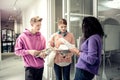 Students talking to their curly groupmate before the class Royalty Free Stock Photo