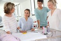 Students with teacher in dressmaking class