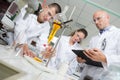 Students and teacher experimenting in lab Royalty Free Stock Photo