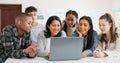 Students, teacher and laptop for group learning, teaching and education in classroom, school or university. Young people Royalty Free Stock Photo