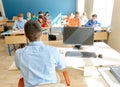 Students and teacher with pc computer at school