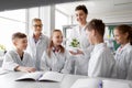 Students and teacher with plant at biology class Royalty Free Stock Photo