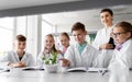 Students and teacher with plant at biology class Royalty Free Stock Photo