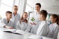 Students and teacher with plant at biology class Royalty Free Stock Photo