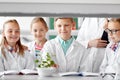 Students and teacher with plant at biology class Royalty Free Stock Photo