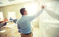 Students and teacher writing on school white board Royalty Free Stock Photo