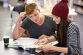 A-students teaming up. two college students studying together at the library. Royalty Free Stock Photo