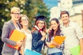 Students or teenagers with files and diploma Royalty Free Stock Photo