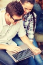 Students or teenagers with laptop computer Royalty Free Stock Photo