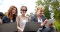 Students or teenagers with laptop computers