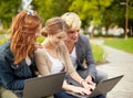 Students or teenagers with laptop computers