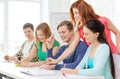 Students with textbooks and books at school Royalty Free Stock Photo