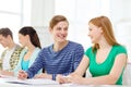 Students with textbooks and books at school Royalty Free Stock Photo