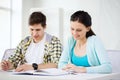 Students with textbooks and books at school Royalty Free Stock Photo