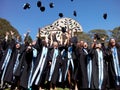 Students throwing graduation hats