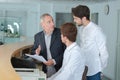 Students traing to become concierge at hotel reception Royalty Free Stock Photo