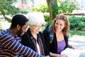 Students and tutor in discussion Royalty Free Stock Photo