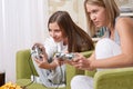 Students - Two female teenager playing TV game