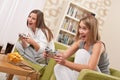 Students - Two female teenager playing TV game