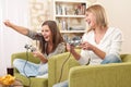 Students - Two female teenager playing TV game