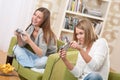 Students - Two female teenager playing TV game