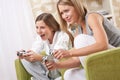 Students - Two female teenager playing TV game