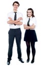 Students in uniform posing with arms crossed Royalty Free Stock Photo