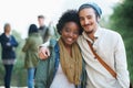 Students, university and portrait of interracial couple of friends on campus with hug and an embrace together outdoor Royalty Free Stock Photo