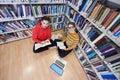 the students uses a notebook, laptop and a school library Royalty Free Stock Photo