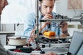 Students using a 3D printer