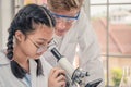 Students using microscope in science laboratory class Royalty Free Stock Photo