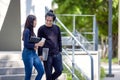 Students walk the stairways on campus, a couple walking down into the ground for extra education Royalty Free Stock Photo