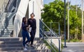 Students walk the stairways on campus, a couple walking down into the ground for extra education Royalty Free Stock Photo