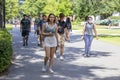 Students walking on campus, one with a protective face covering, at the University of Georgia Royalty Free Stock Photo