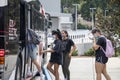 Students wear protective face masks while boarding a bus on the University of Georgia campus