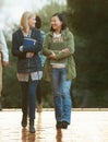 Students, women and friends on campus for college, conversation while walking to class and smile. University Royalty Free Stock Photo