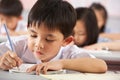 Students Working At Desks In Chinese School