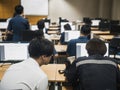 Students working together in computer room during lecture class seminar.