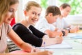 Students writing a test in school concentrating Royalty Free Stock Photo