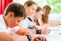 Students writing a test in school concentrating Royalty Free Stock Photo