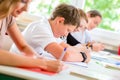 Students writing a test in school concentrating Royalty Free Stock Photo