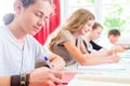 Students writing a test in school concentrating Royalty Free Stock Photo