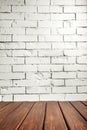 Studio background. White brick wall and wood floor Royalty Free Stock Photo